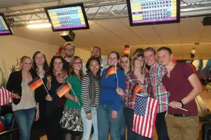 Photos of participants of Bamberg Buddies at the Bowling alley, ice skating and watching a basketball match in the Brose Arena in Bamberg.